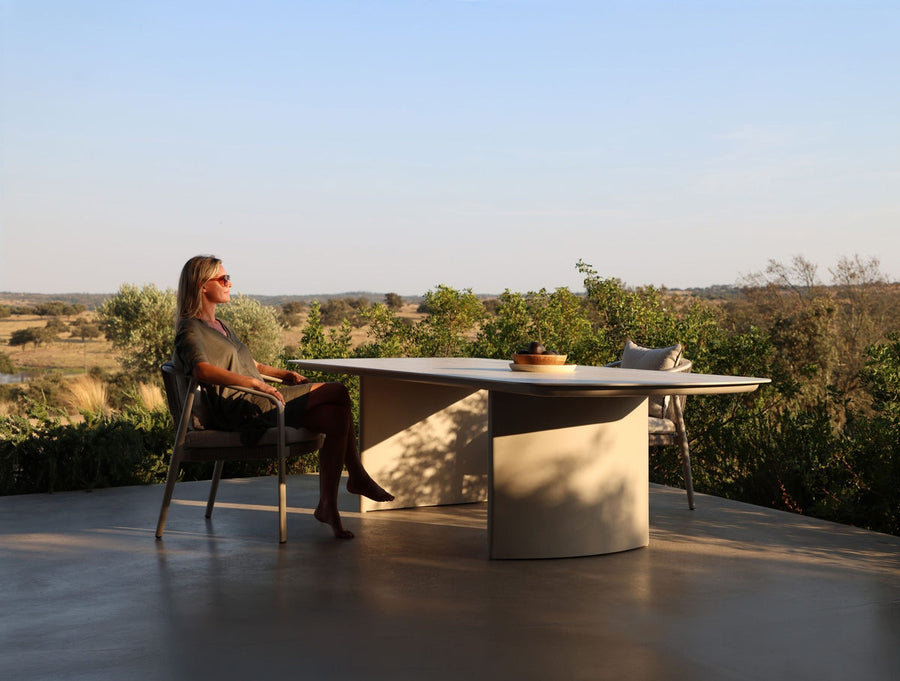 Horizon outdoor dining table on a terrace at sunset, modern outdoor dining furniture from SoBe Furniture, Boca Raton